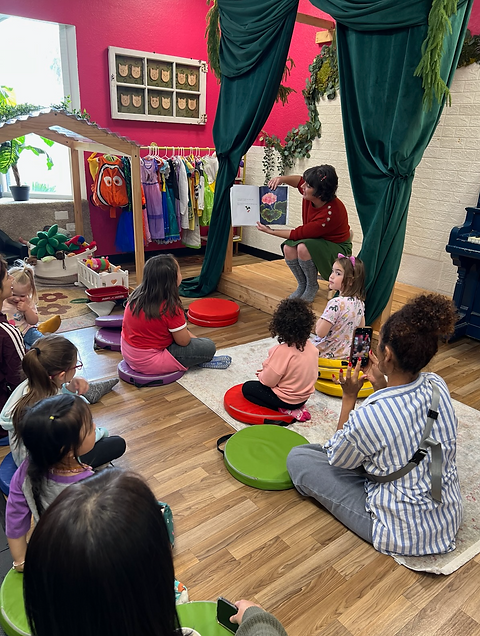 Children gathered for a story or group activity at Space To Play