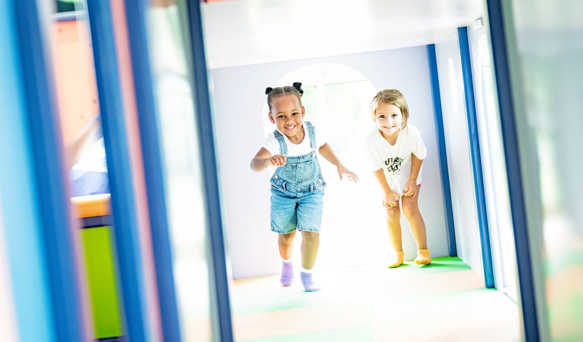 Indoor play seating and activity space at Sprouts