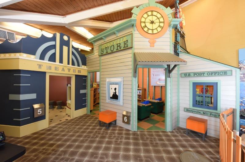 Child-size Storyville storefront play village inside the Rosedale library branch.