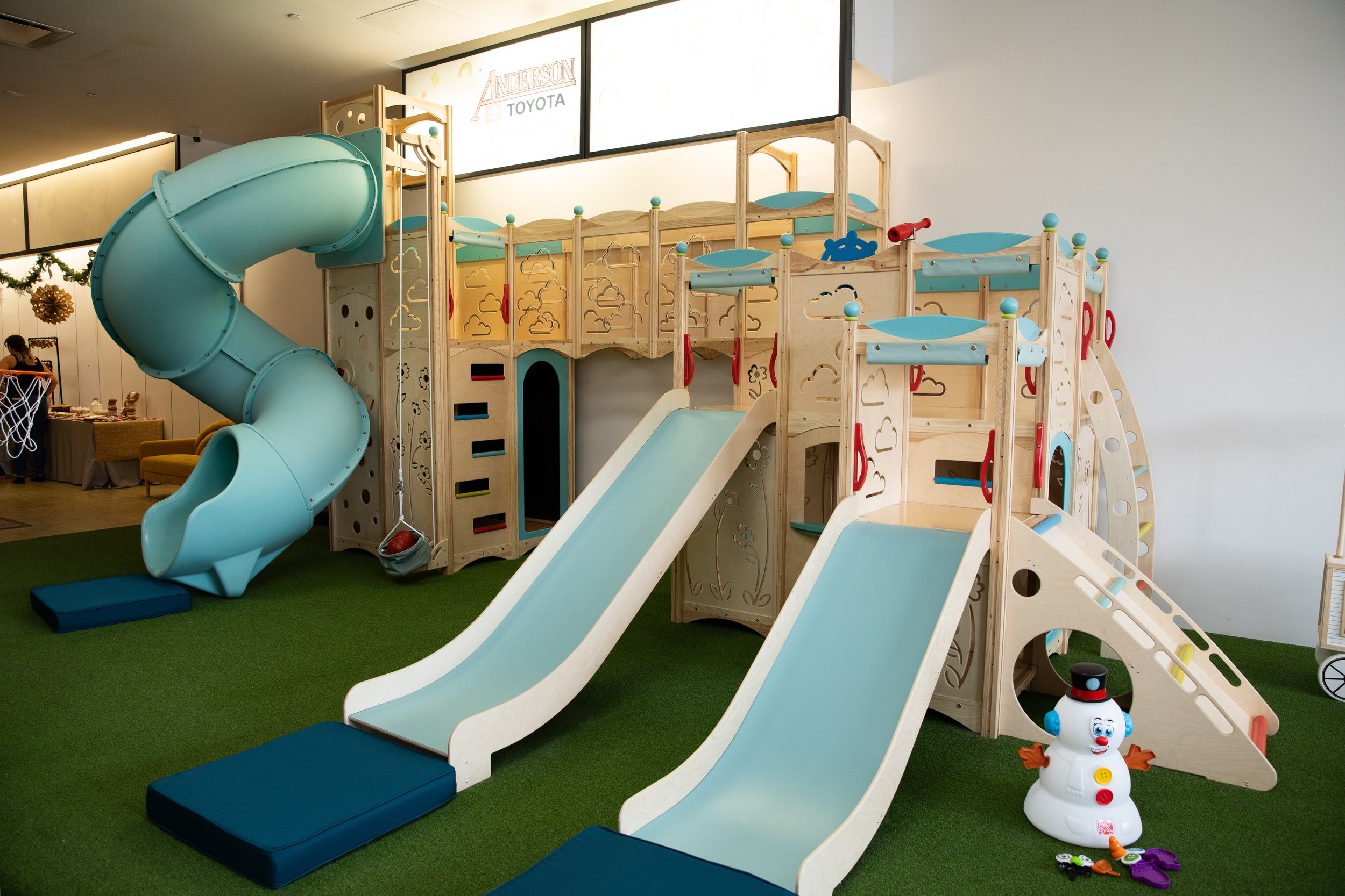Pretend play area with child-sized activity zones at Sunshine Indoor Play