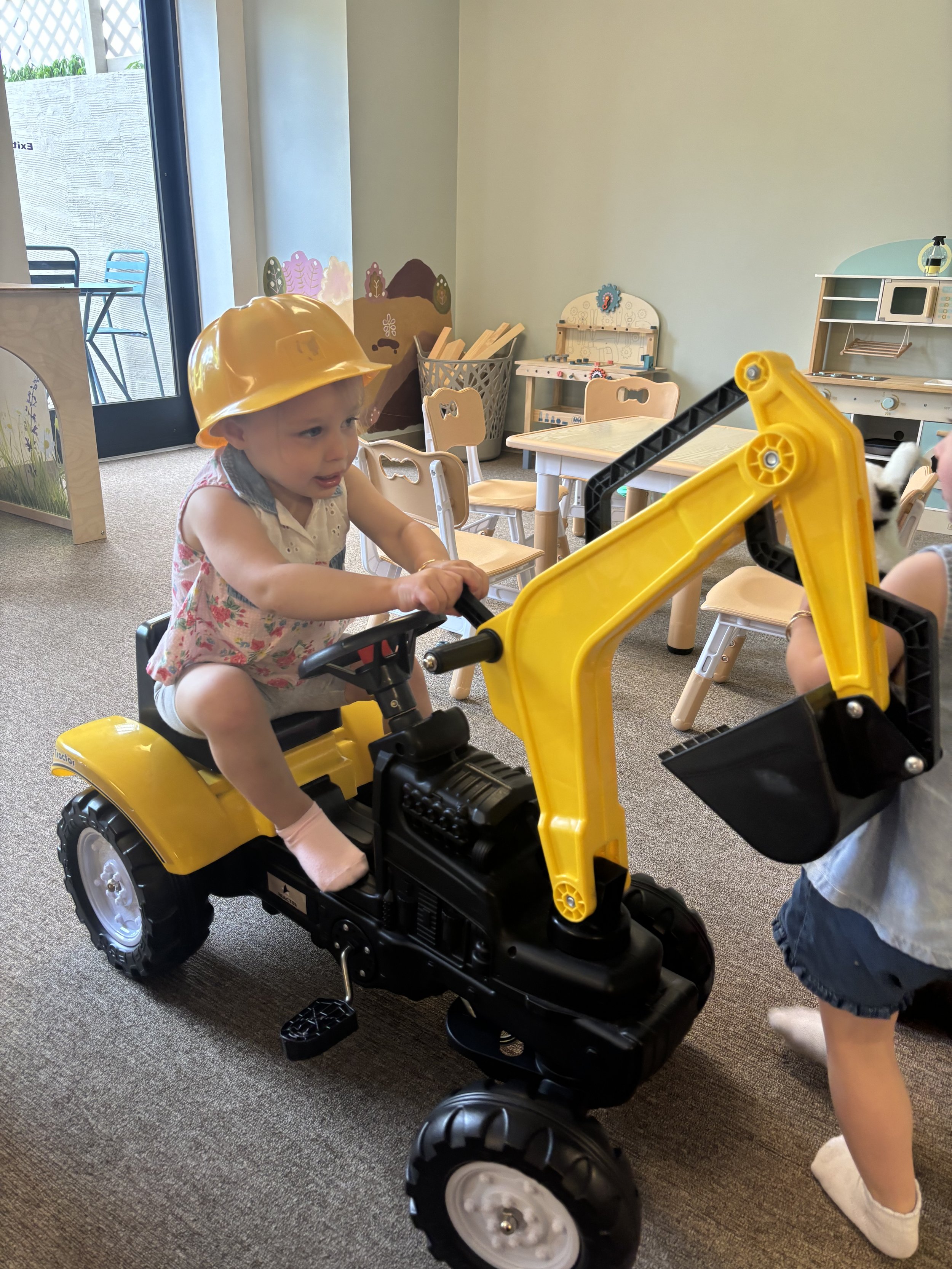 Another view of Sunshine Play Café's indoor play setup and seating.