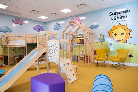 Indoor play structures and seating at Surprise and Shine