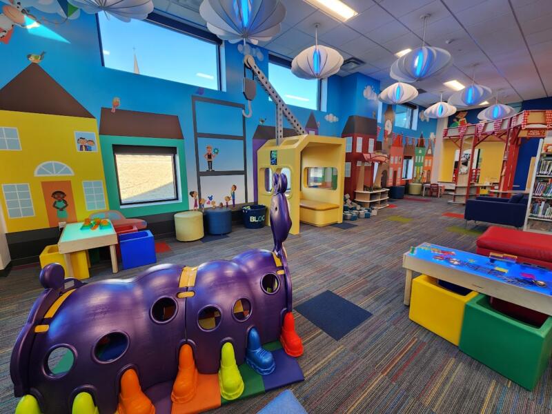 Play equipment and activity zones at Talk Read Play Center