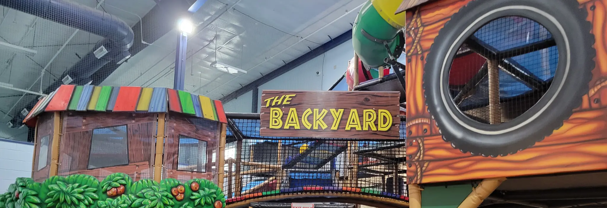 The Backyard sign and entry area inside the Detroit Lakes play structure