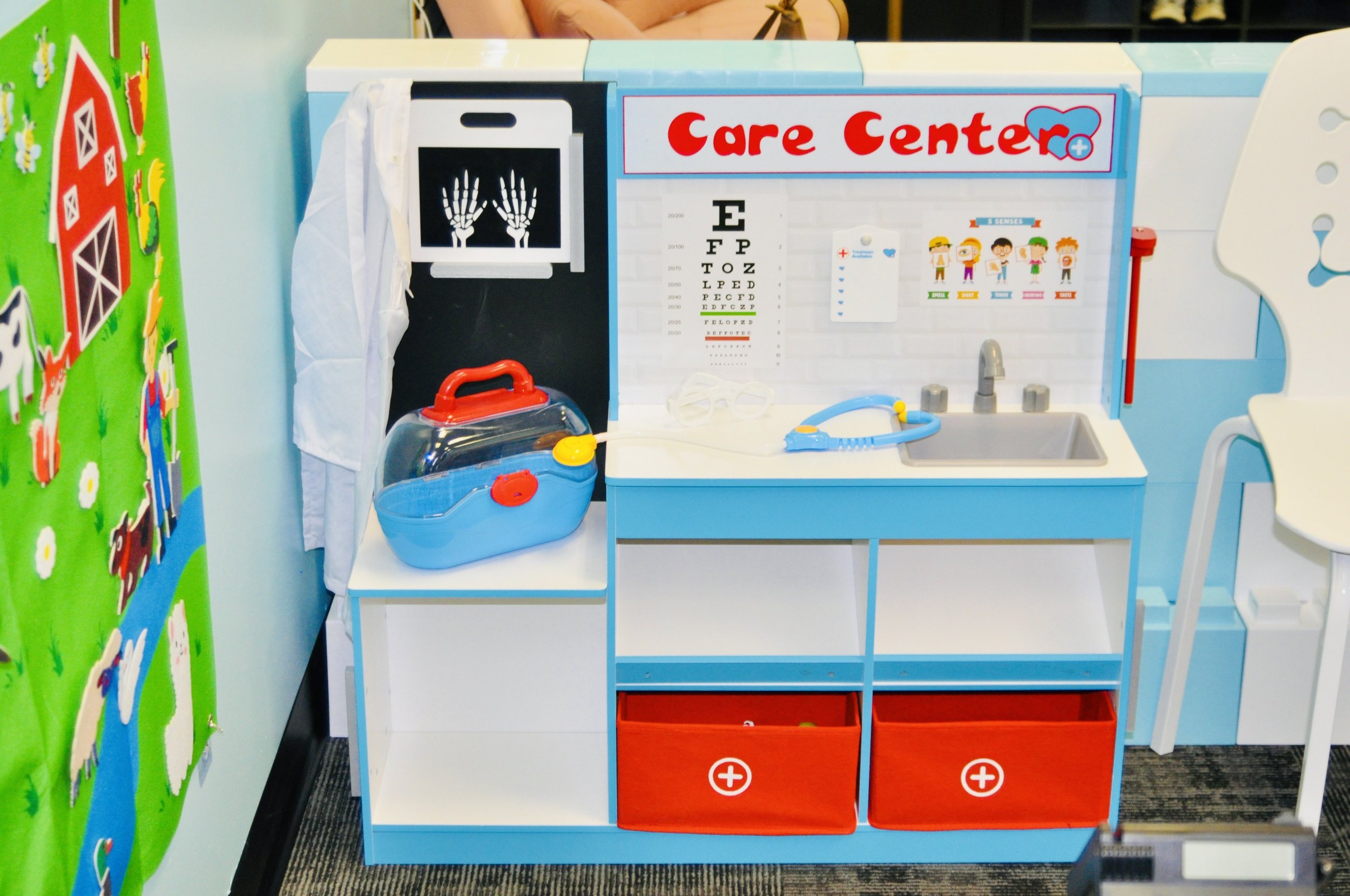 Doll and baby-care themed play area at The Beach House Play Center.