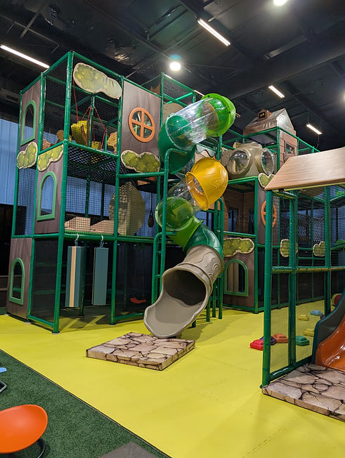Multi-level soft-play playground at The Bee's Knees Play Cafe.