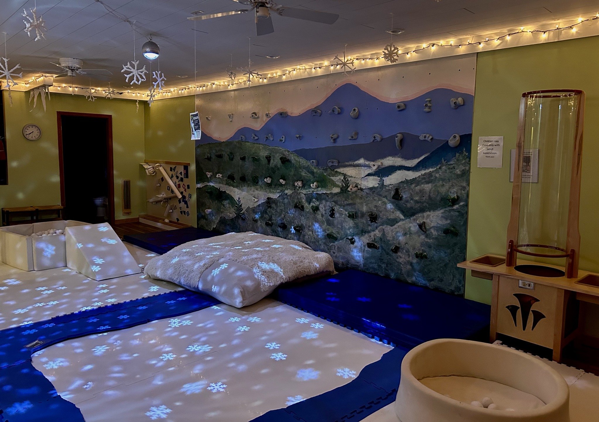 Children exploring a hands-on exhibit room at The Children's Playhouse in Boone.