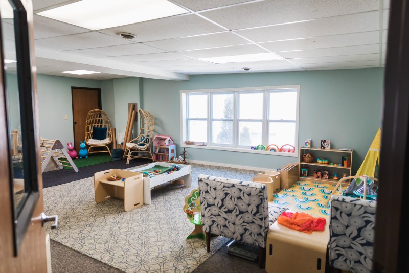 Open play room with curated toys at The Emerging Parent.