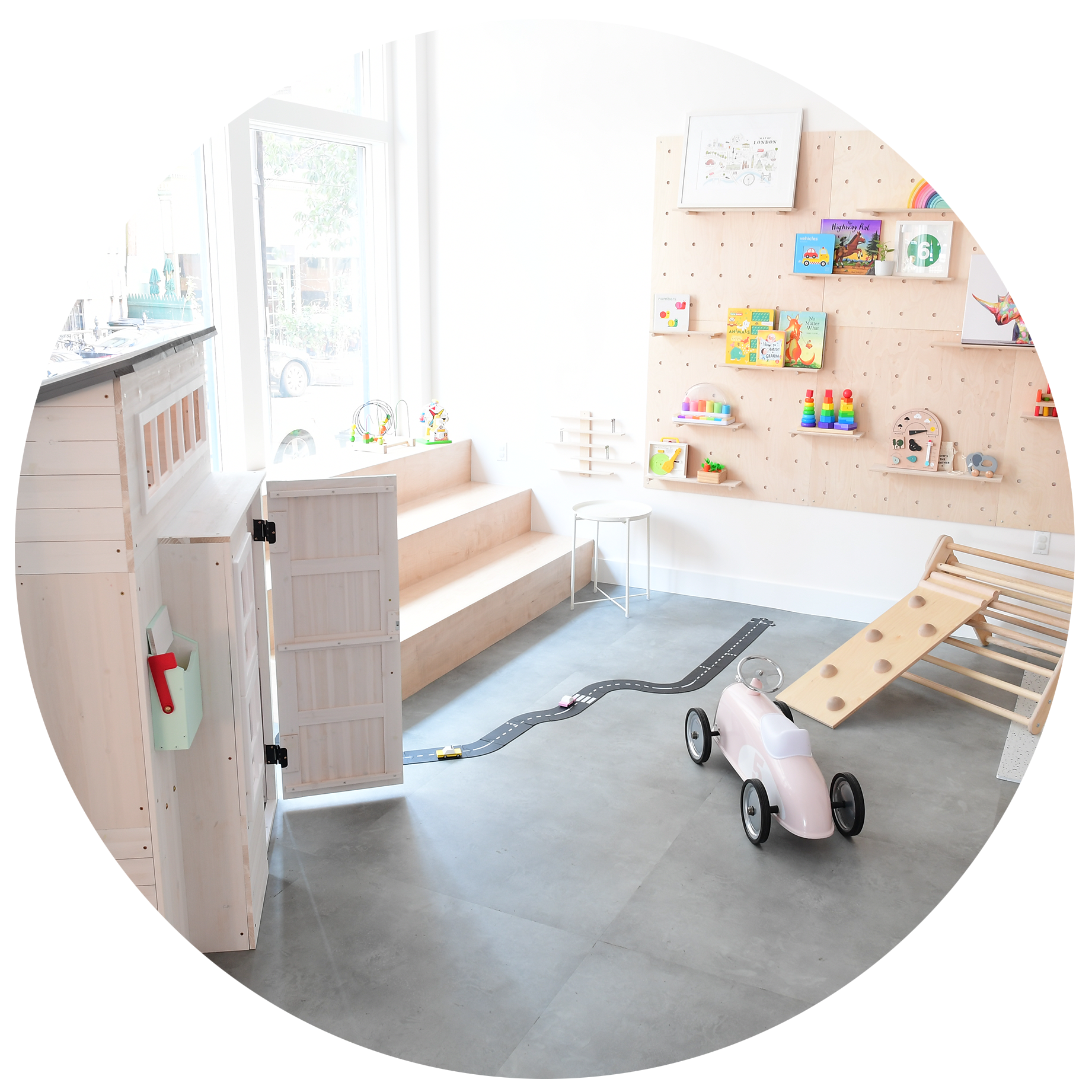 Wooden toy play corner inside The Hive Market Play Space.
