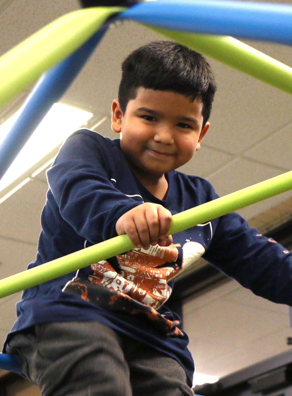 Caregiver-friendly indoor play area with climbing features at The Jungle.