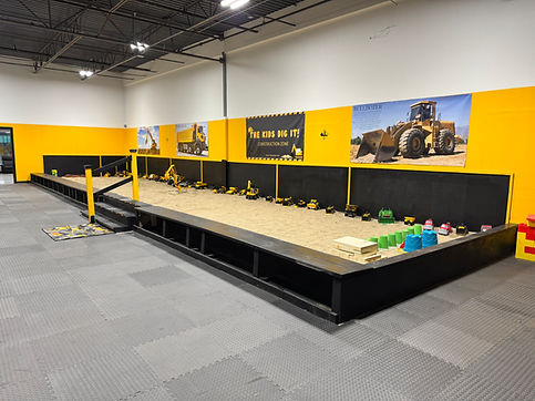 Indoor sandbox play area at The Kids Dig It.