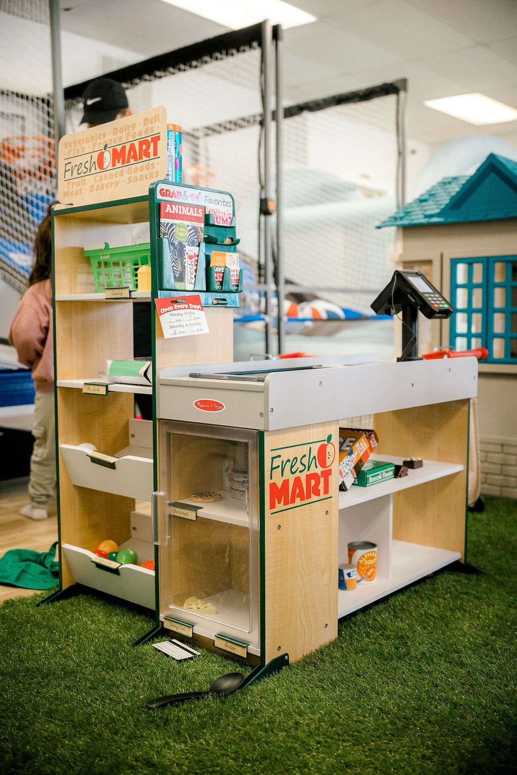 Pretend-play and indoor activity area at The Lemon Lounge.