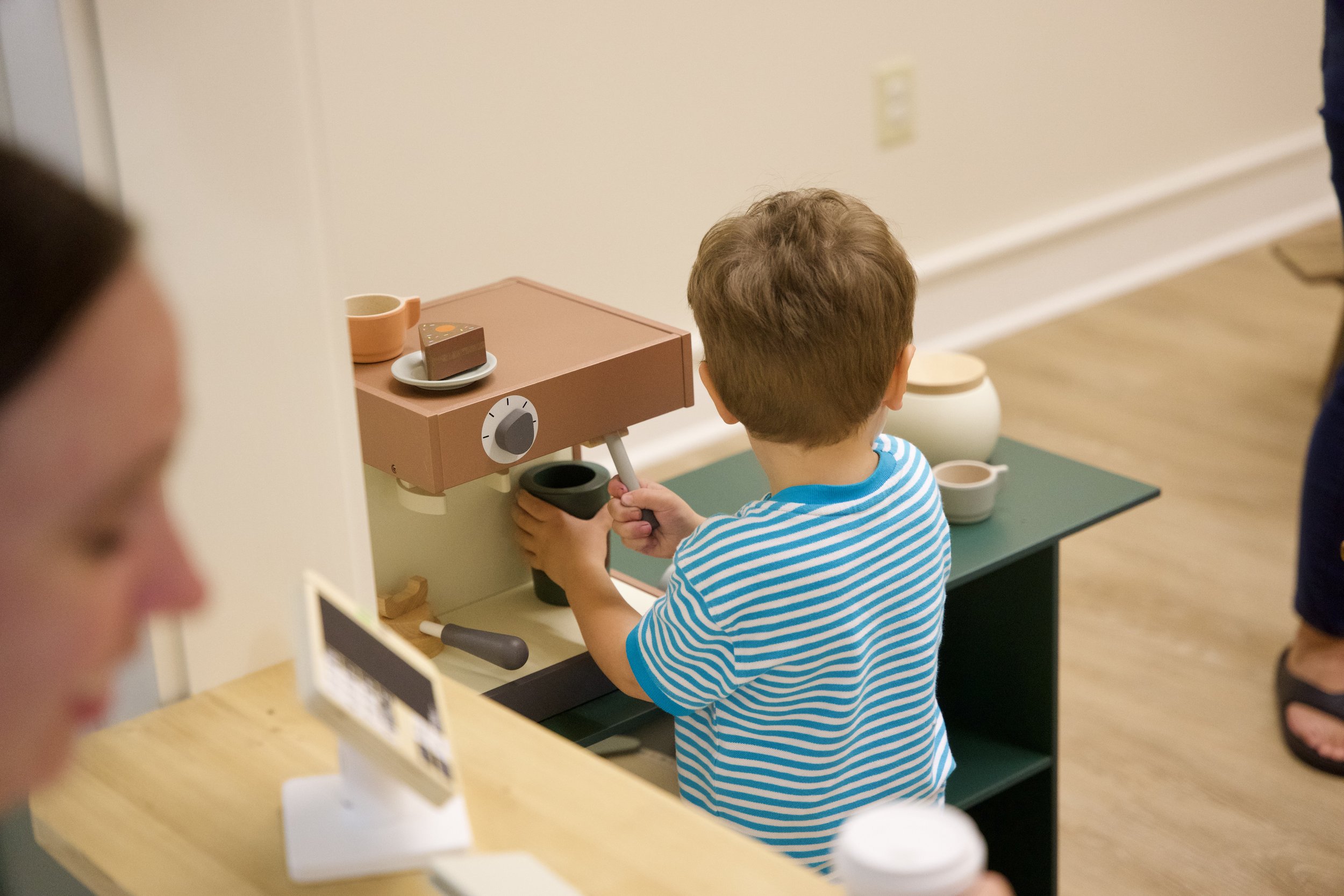 Pretend-play station inside The Little Village on 13th