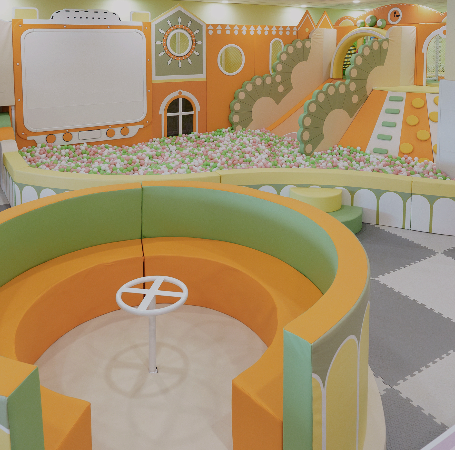 Orange and green ball pit area at The Littles Play Cafe