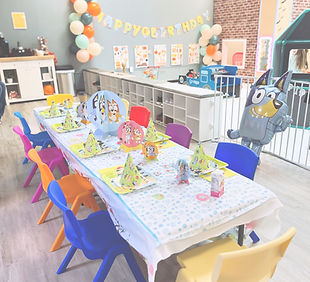 Birthday party table setup inside The Playroom in Morgantown.