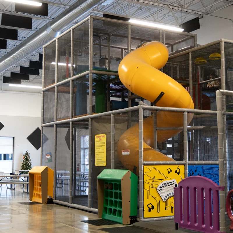 Three-level playscape with slide at The Point.