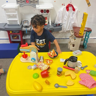 Pretend kitchen setup inside The Tot Spot Fun Factory.