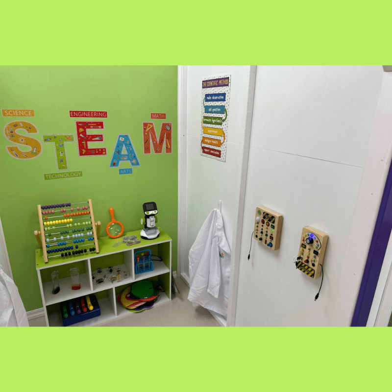 Indoor play area with child-sized buildings and soft-play elements at The Town Square Play Cafe.