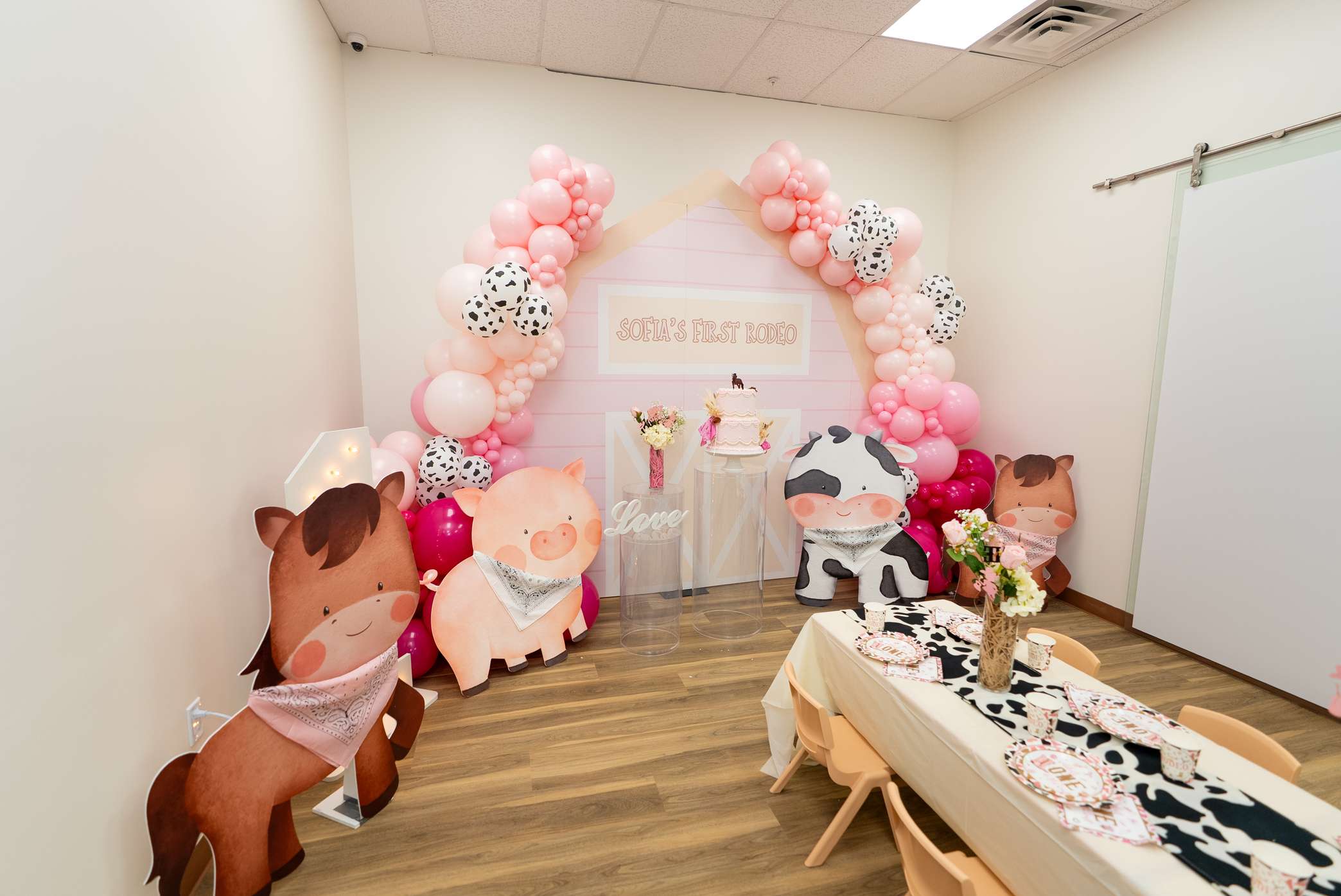A decorated birthday party table inside The Tree House Fort Lauderdale.