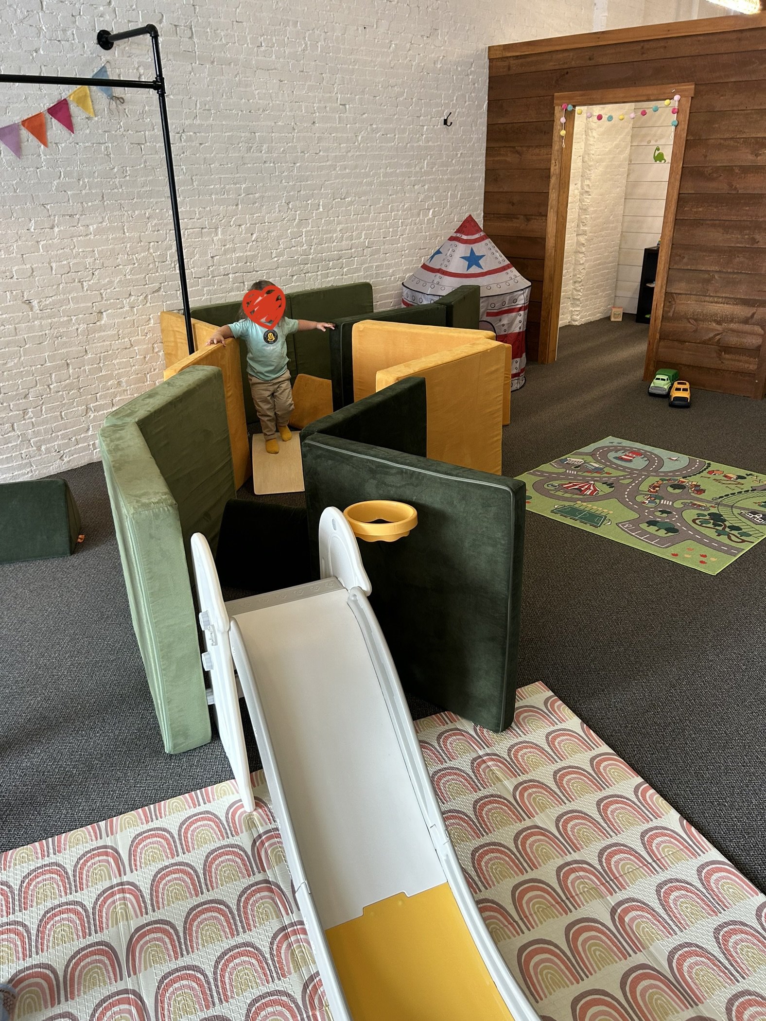 Soft climbing maze and slide area at The Village.