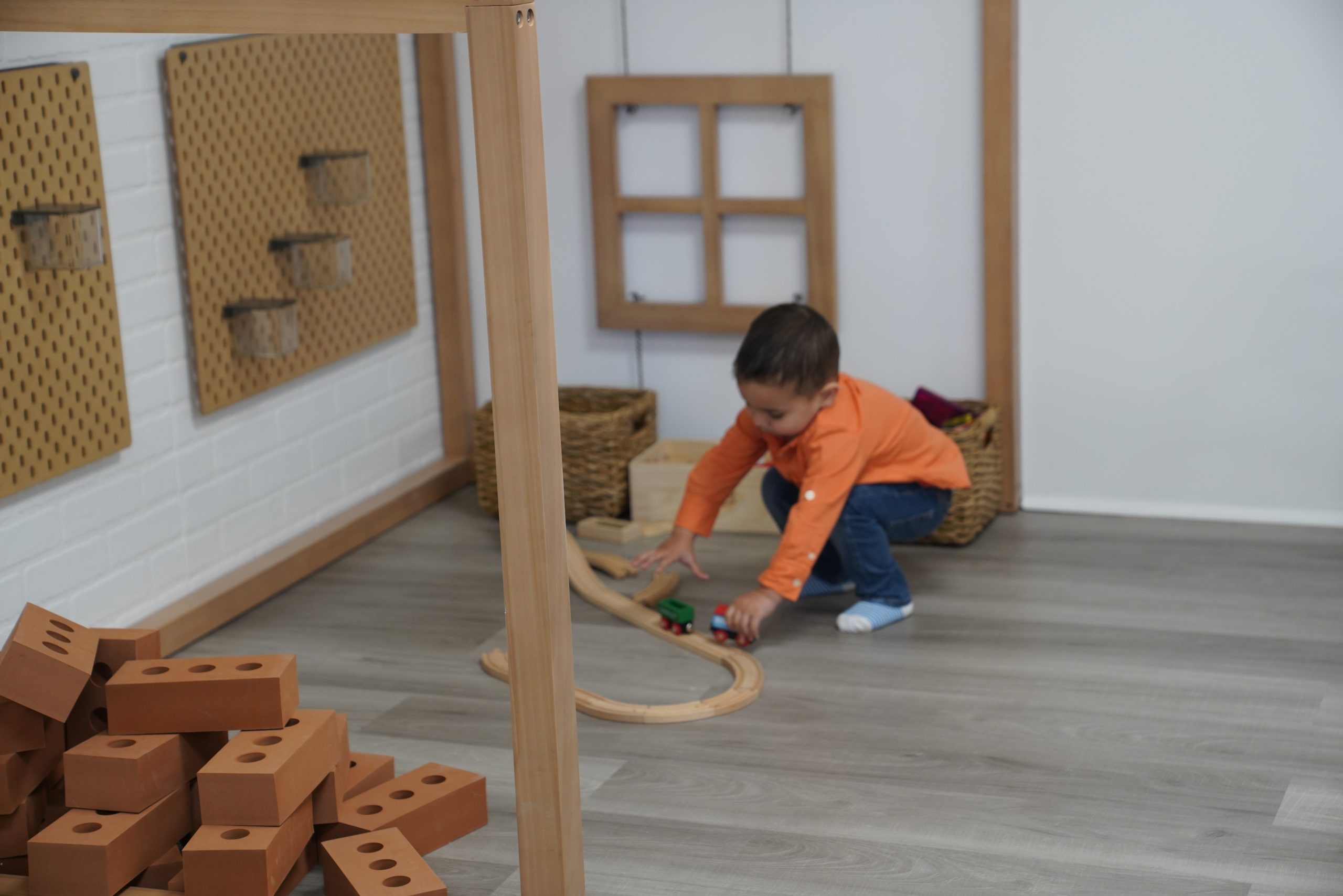 Child playing in the open-play area at The Village Edgewater.