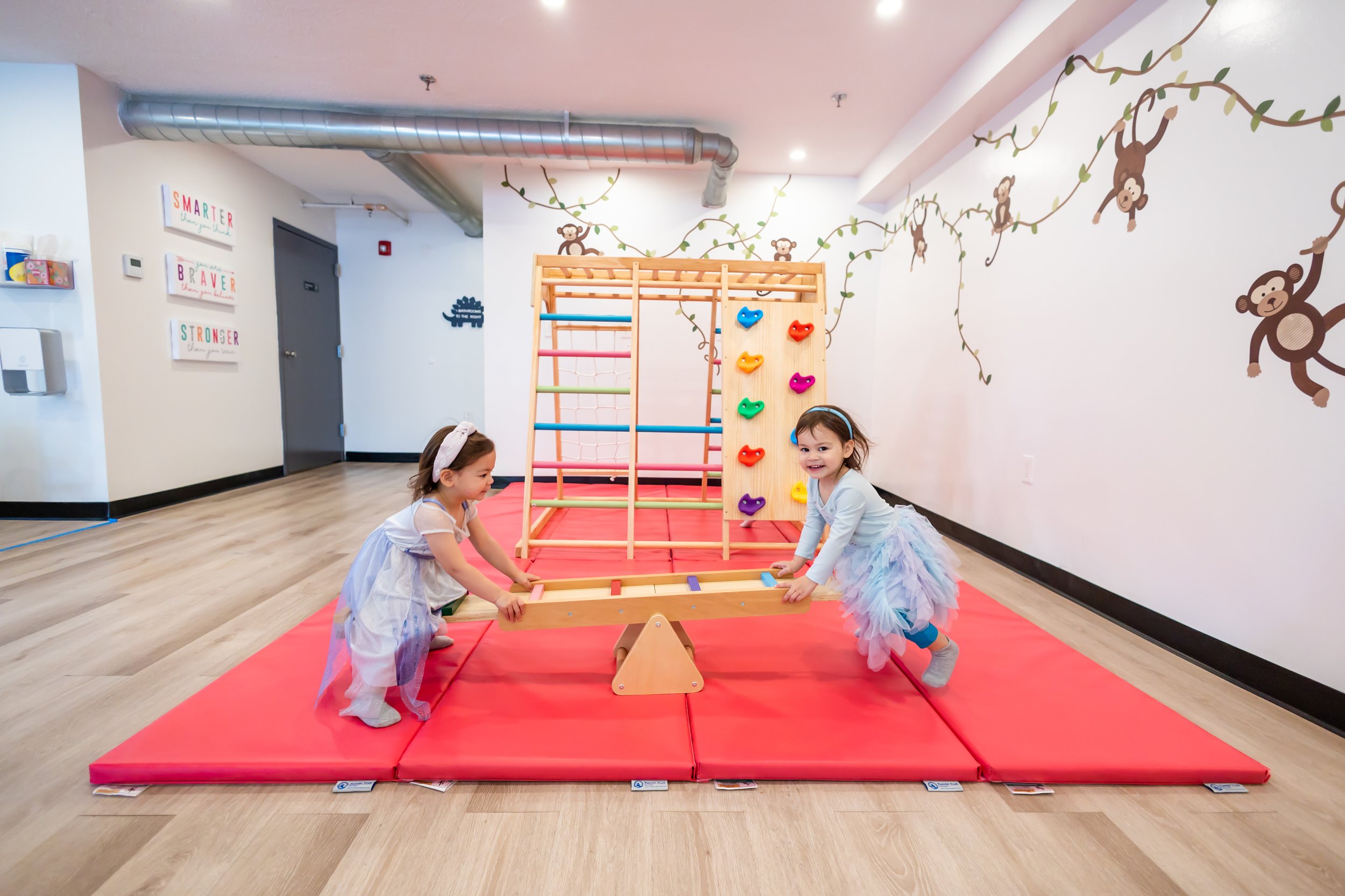 Children and caregivers using the playroom at The Village Playspace in Medford.