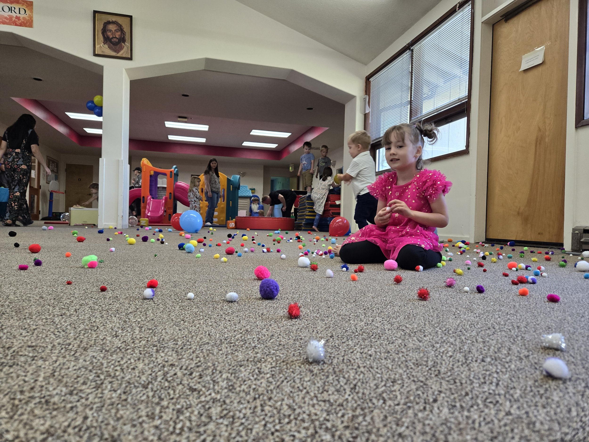 Children using indoor play equipment at Tiny Tots Co-Op in Eugene.