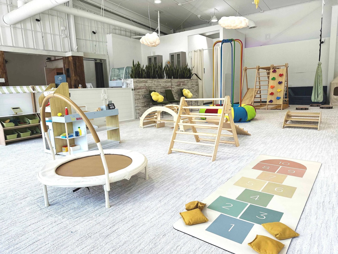 Bright indoor play area sized for babies, toddlers, and preschoolers.