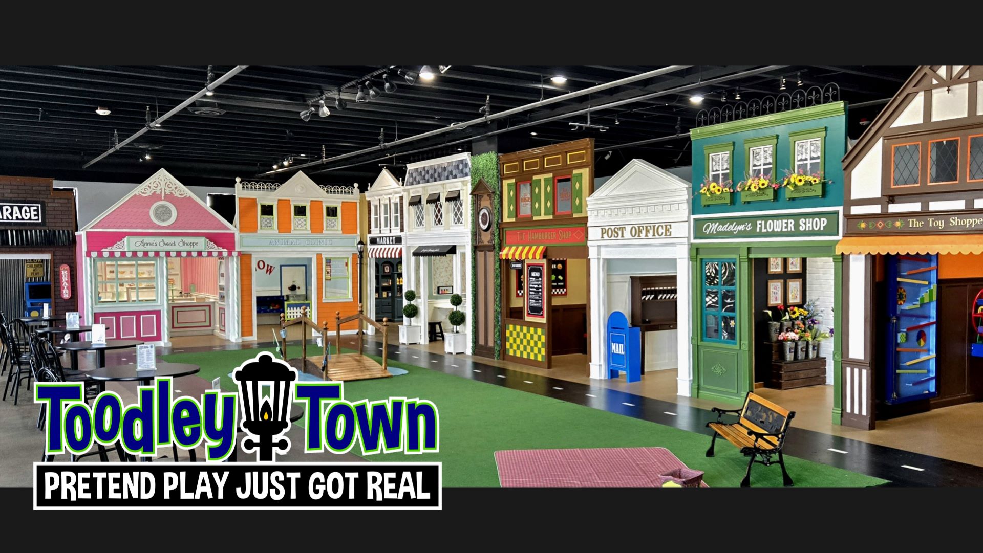 Wide view of Toodley Town's child-sized pretend-play streetscape.