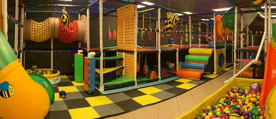 Indoor soft-play layout with climbing features and a ball pit at Tumble Beez.