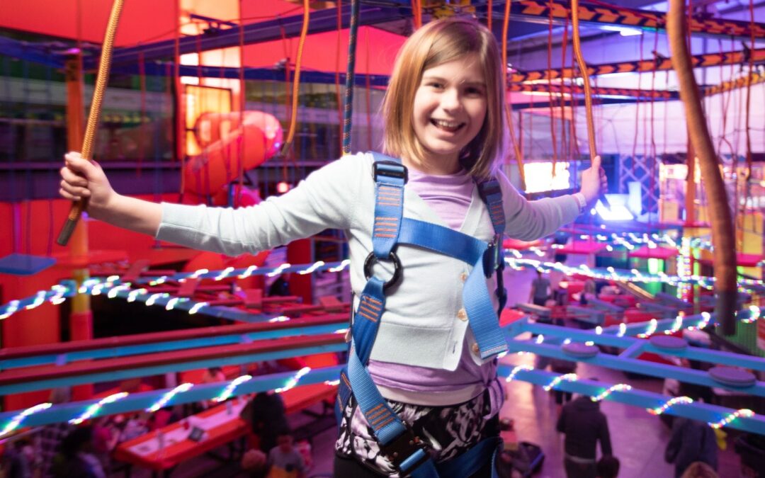 Children climbing and playing at Urban Air Adventure Park Conway.