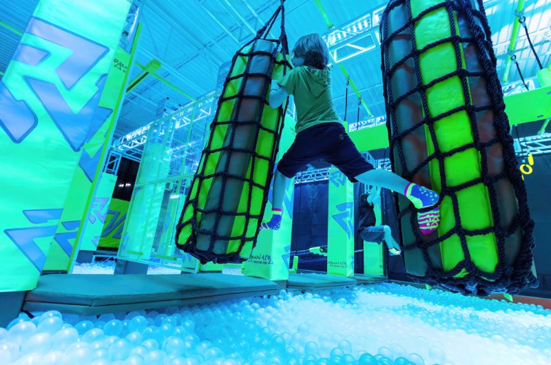 Kids using climbing and aerial-style attractions at Urban Air Adventure Park - Destin.