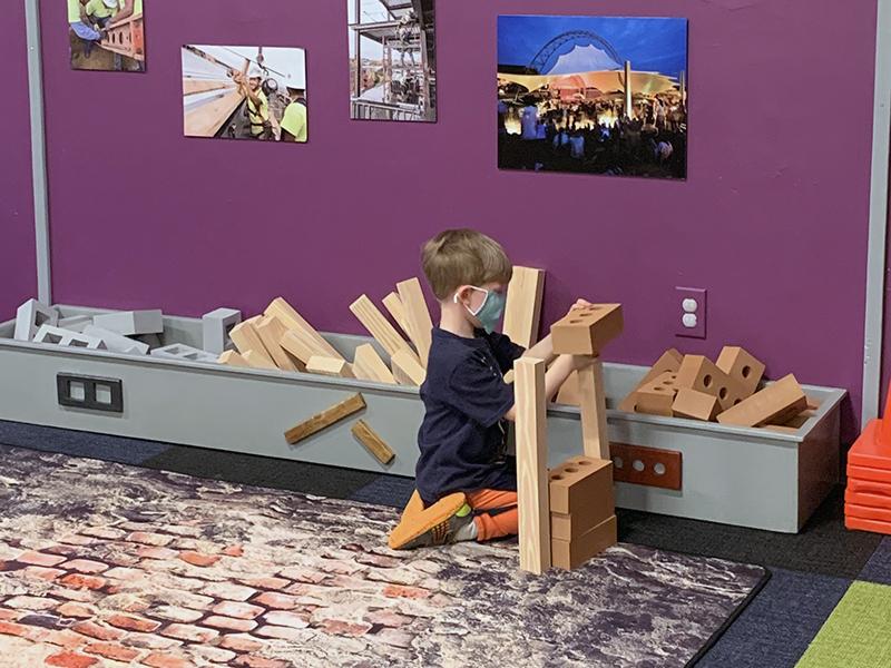 Children playing in the construction-themed exhibit at Virginia Discovery Museum.