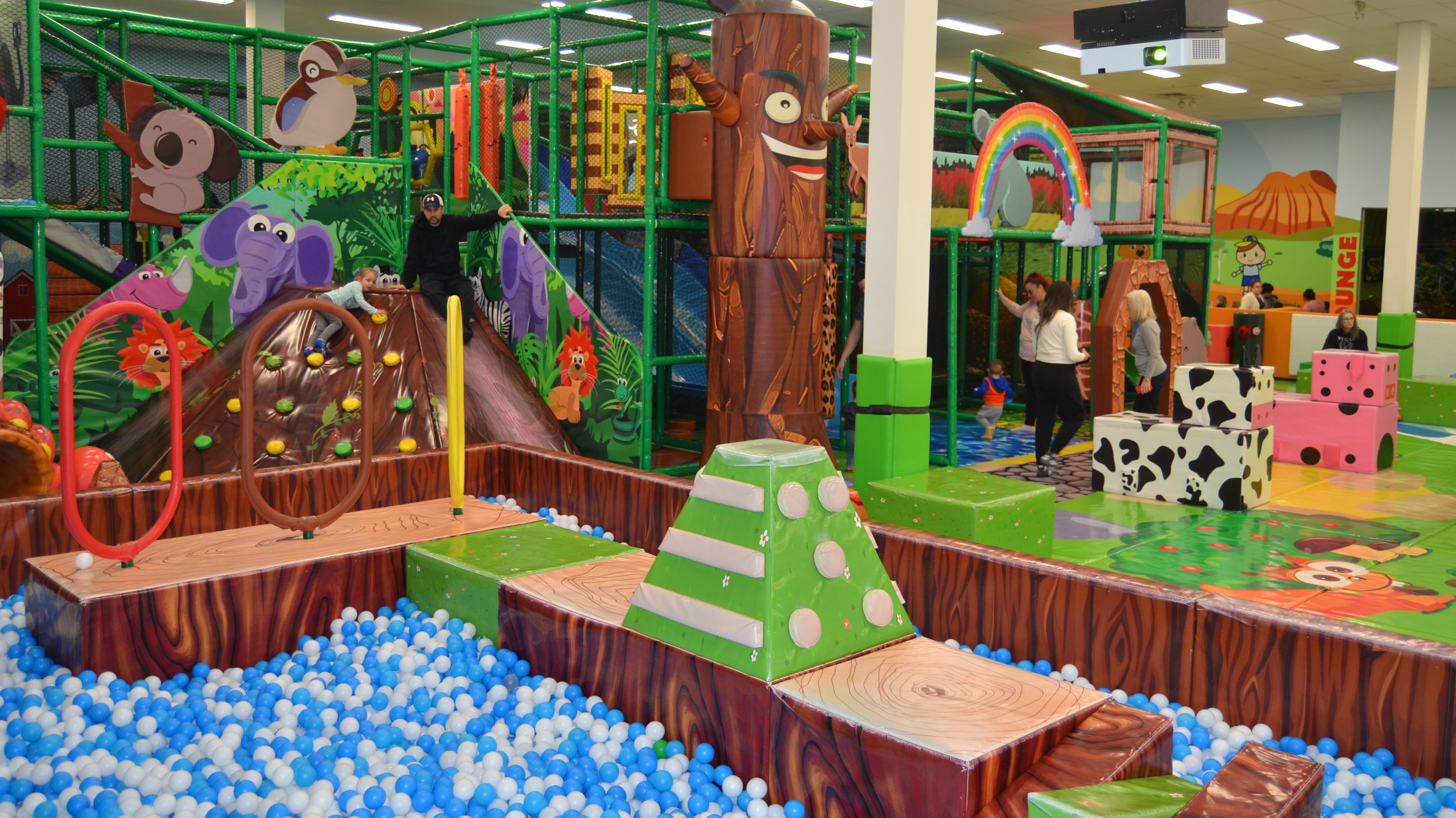 Children's play area with bright climbing and slide features at Wally Wombats.