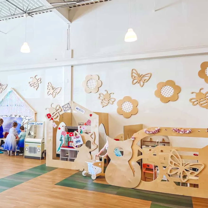 Pretend-play village area inside Wild Ones Play Cafe.