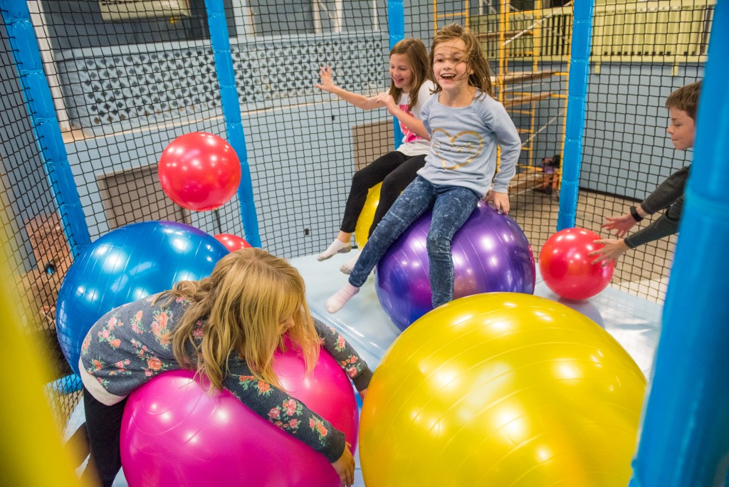 Children playing in the giant ball room area at Wippersnappers.