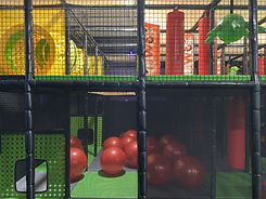 Colorful soft-play area with ball pit and climbing features at Xplore Family Fun Center.
