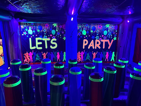 Party room with glow decor at Xplore Family Fun Center.