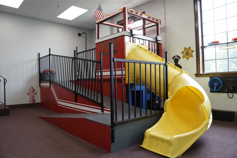 Fire-truck themed indoor play area at York Area Children's Museum.