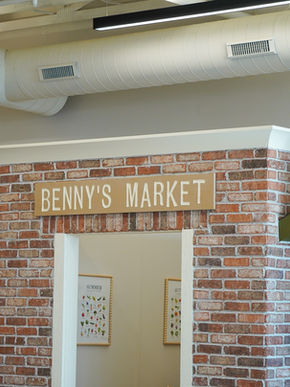 Pretend-play market setup inside Zen Benny's Play Cafe.