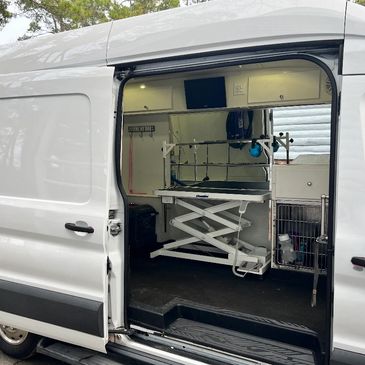 White mobile grooming van used by Adore Pet Spa