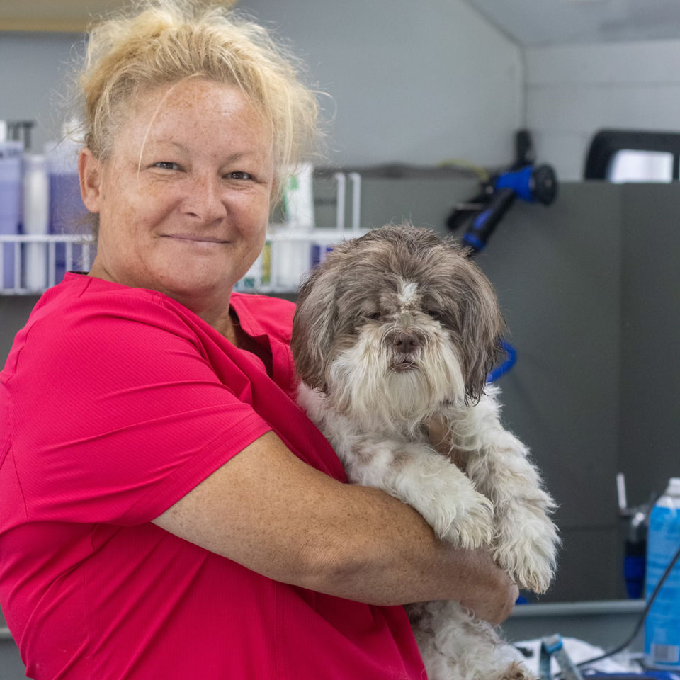 Pet groomer with a client's dog