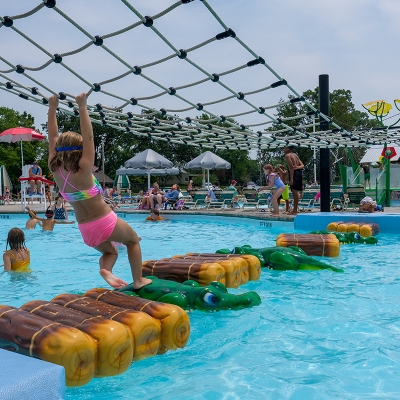 Floating bridge challenge feature at Alligator's Creek Aquatic Center.