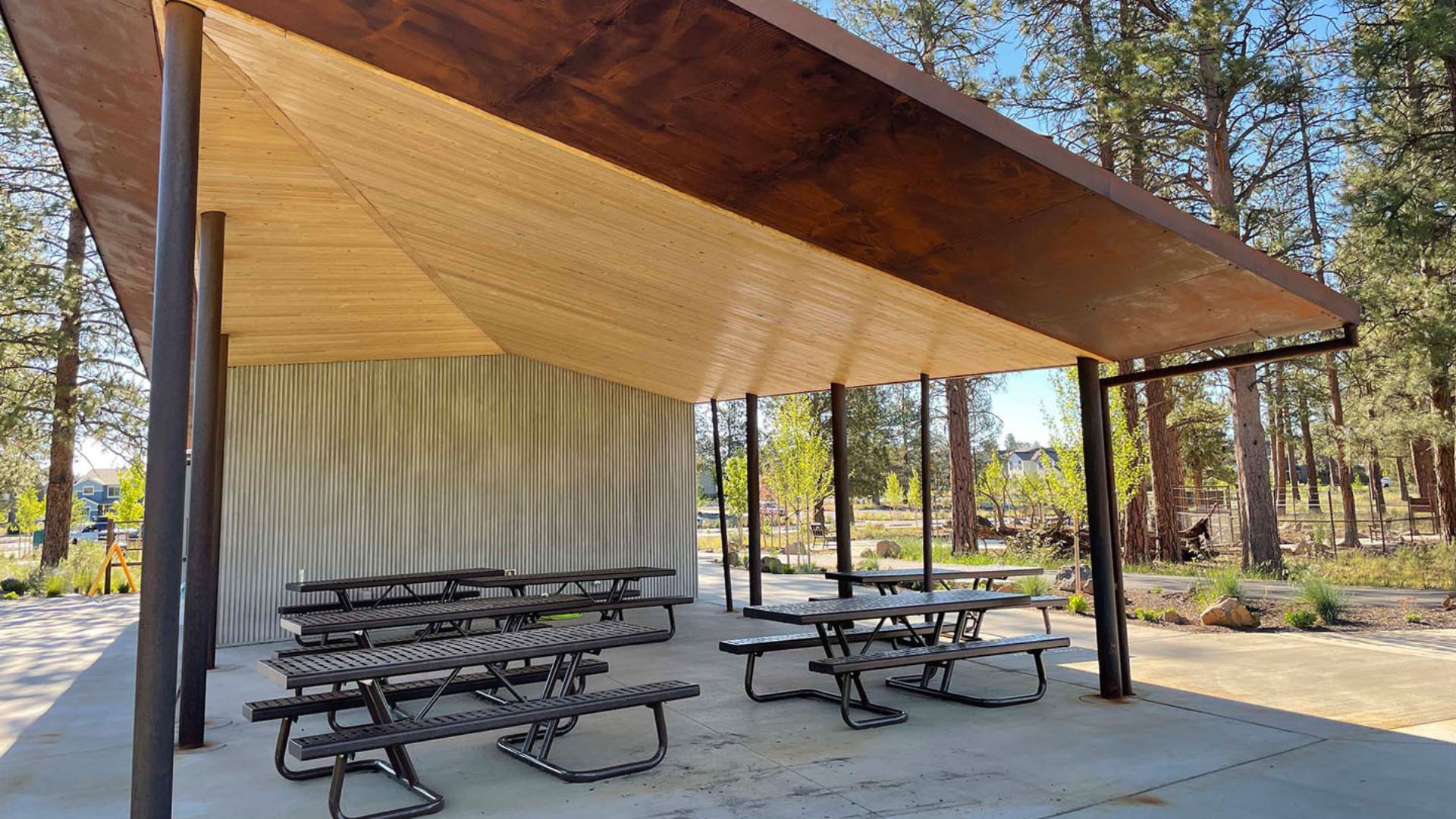 Picnic shelter beside the sprayground and playground at Alpenglow Park.