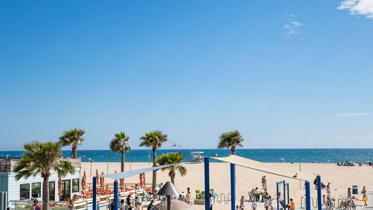 Kids playing at the Annenberg Beach House playground.