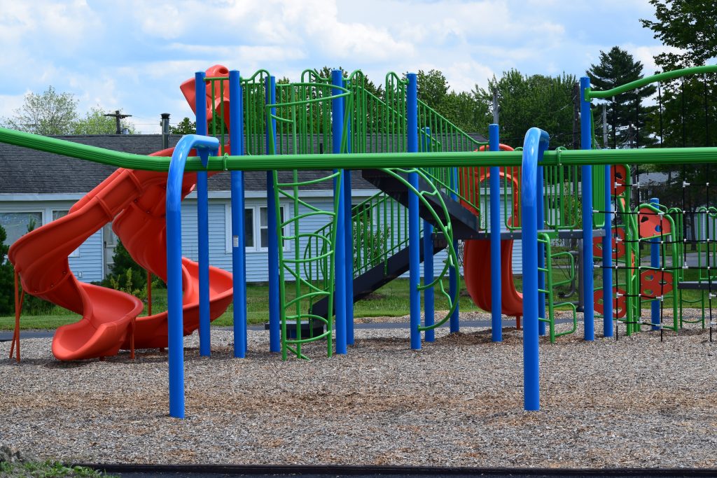 Family park setting around BangorHousing Splash Pad.