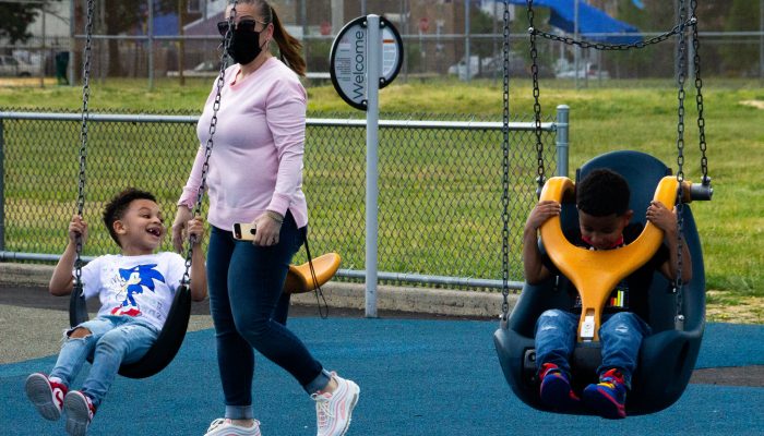 Children on the updated play equipment at Carmella Playground.