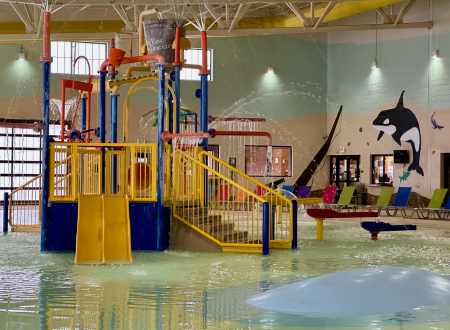 Aquatic Center pool image used on the official hours page.