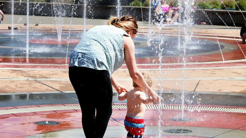 Families enjoying the fountain in downtown Gresham.