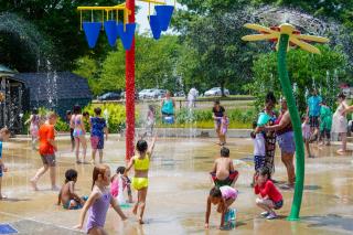 Children enjoying spray features at Colonial Park Spray Park.